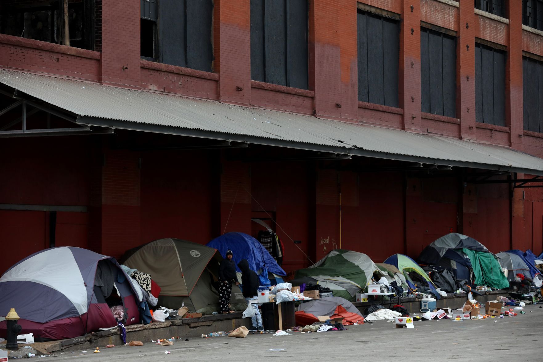 Tent encampment outside McGuire Moving & Storage building